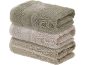 Stack of three folded towels in varying shades of beige with a patterned border.