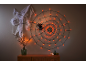 Spiderweb with orange lights, spider, and decorative branches for Halloween.