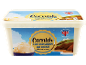 A tub of clotted cream ice cream with a Cornish theme, featuring a scoop of ice cream.