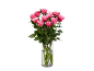 Bouquet of pink roses in a glass vase on a black background.
