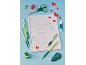 Green and red school supplies with a notebook featuring a drawn alphabet and hearts.