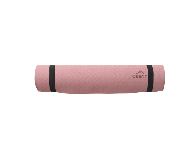 Rolled pink exercise mat with black straps