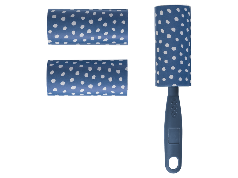 Lint roller with blue handle and two replacement rollers with white polka dots.