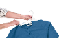 Hands hanging a blue cardigan on a white hanger.