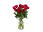 A bouquet of fresh red roses in a clear glass vase.