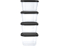 Stack of four clear rectangular food containers with black lids.