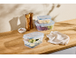 Silvercrest food storage containers with click closure, filled with fruit, cheese, and vegetables.