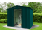 Green garden shed with sliding door, ladder, shovel, and crate of apples.