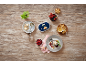Coffee flavored ice cream with fruit and cookies on a wooden table.