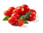 Fresh red cherry tomatoes with green leaves and water droplets.
