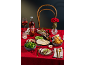 Romantic dinner with duck pancakes, green salad, and desserts, featuring a red drink.