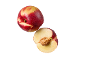Whole and halved nectarine with water droplets on a black background.
