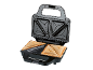 Open sandwich maker with two toasted sandwiches inside, ready to eat.
