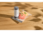 Vacuum sealer and bags with sliced apples on a wooden table.