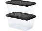 Two clear food containers with black lids, stacked on top of each other.