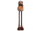 Plush hedgehog toy with long legs holding an orange leaf.