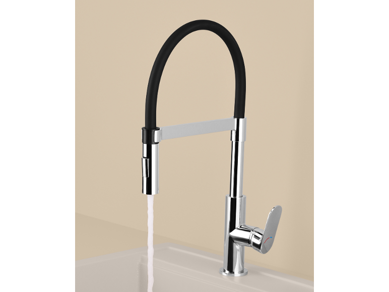 Modern kitchen faucet with a black flexible hose and running water into a sink.
