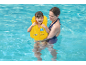 Mother and child wearing a yellow swim vest in a pool.