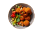 Arancini with fresh tomato, lettuce, and olive salad in a bowl.