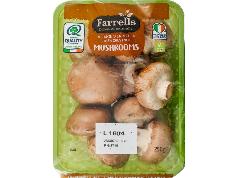 A pack of vitamin D enriched Irish chestnut mushrooms, 250g, with quality assurance and origin labels.