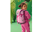 Girl with pink backpack featuring dinosaur drawings and text 'WE'VE GOT PAWS TO SAVE!'