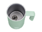 Mint green milk frother with metallic interior and spring whisk.