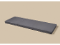 Gray three-section folding mattress on a beige background.