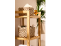 Bamboo shelf with woven baskets, fragrance, and care products.