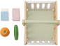 Wooden toy shopping cart with milk, grape juice, orange, and cucumber.