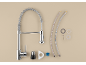Kitchen faucet with pull-down sprayer, hoses, and installation accessories on a beige background.