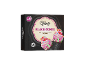 Box of 4 black vanilla and raspberry ice cream cones with colorful sprinkles.