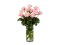 Bouquet of pink roses in a glass vase on a black background.