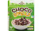 Green cereal box with chocolate shells in a bowl with milk.