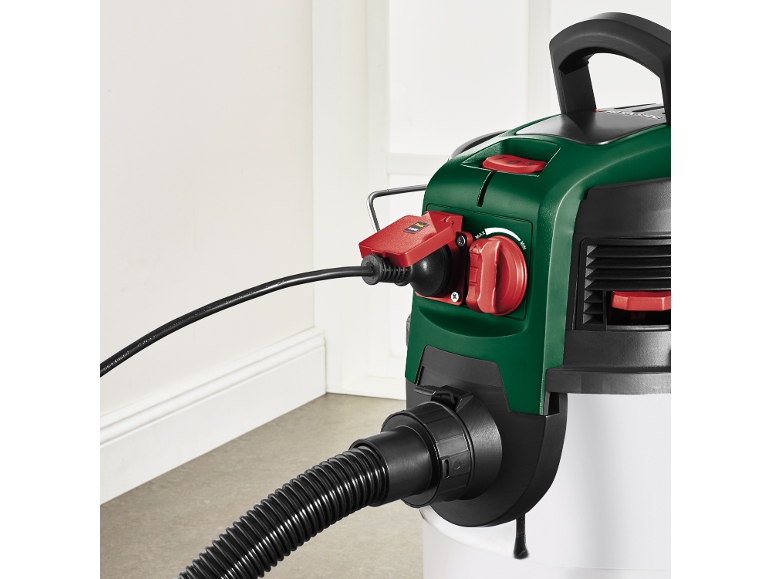 Green and white wet and dry vacuum cleaner with power cable and hose.
