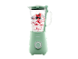 Mint green blender with berries and yogurt.