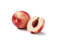 Whole nectarine and a cut half with the pit visible.