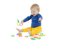 Happy baby playing with colorful linking rings.