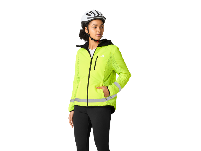 Woman with bike helmet and neon yellow reflective jacket