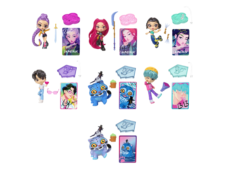 Collection of colorful anime-style dolls, figurines, and trading cards with various accessories.