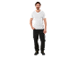 Man in white t-shirt and black work trousers with safety boots.