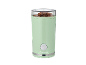 Green coffee grinder with a transparent lid, filled with coffee beans.