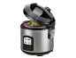 Rice cooker with vegetables steaming inside, lid ajar, on a black background.