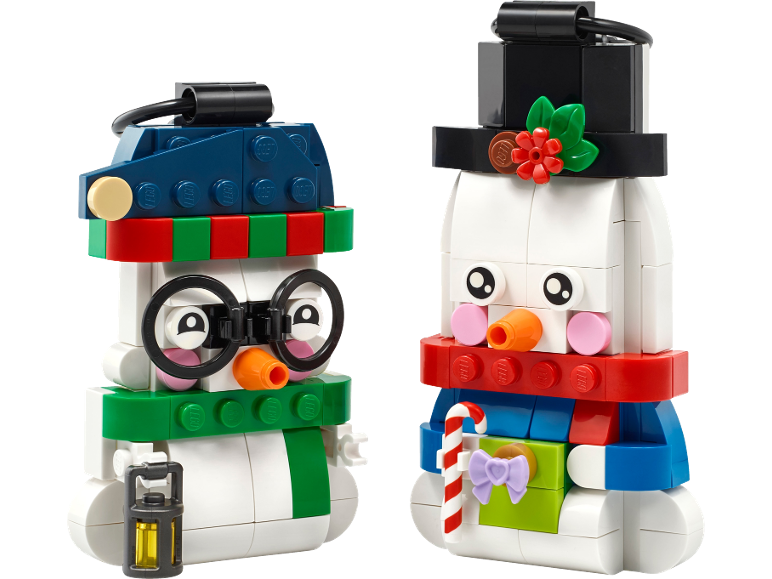 Two toy snowman figures with festive accessories.
