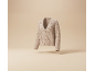 Beige knitted cardigan with buttons, floating against a light background.