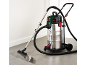 Wet and dry vacuum cleaner with a metal tank, used to clean a puddle of water on the floor.