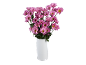 Bouquet of pink daisies in a white vase on a black background.