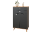 Black cabinet with drawers and doors, featuring a wooden top and legs, adorned with a vase and soap dispenser.