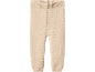 Beige knitted baby trousers with ribbed waistband and cuffs.