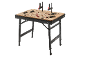 Foldable workbench with clamps and accessories on a black background.