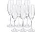 Six clear champagne flutes with frosted stems and bases on a black background